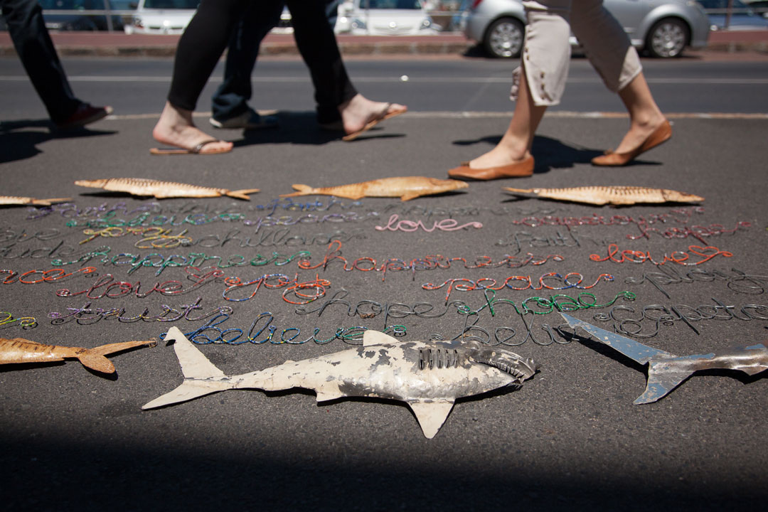 Shark-inspired merchandise sold on the pavement of Kalk Bay, South Africa, a harbour town that looks out onto the renowned Seal Island of False Bay. Photo © Mac Stone | Save Our Seas Foundation